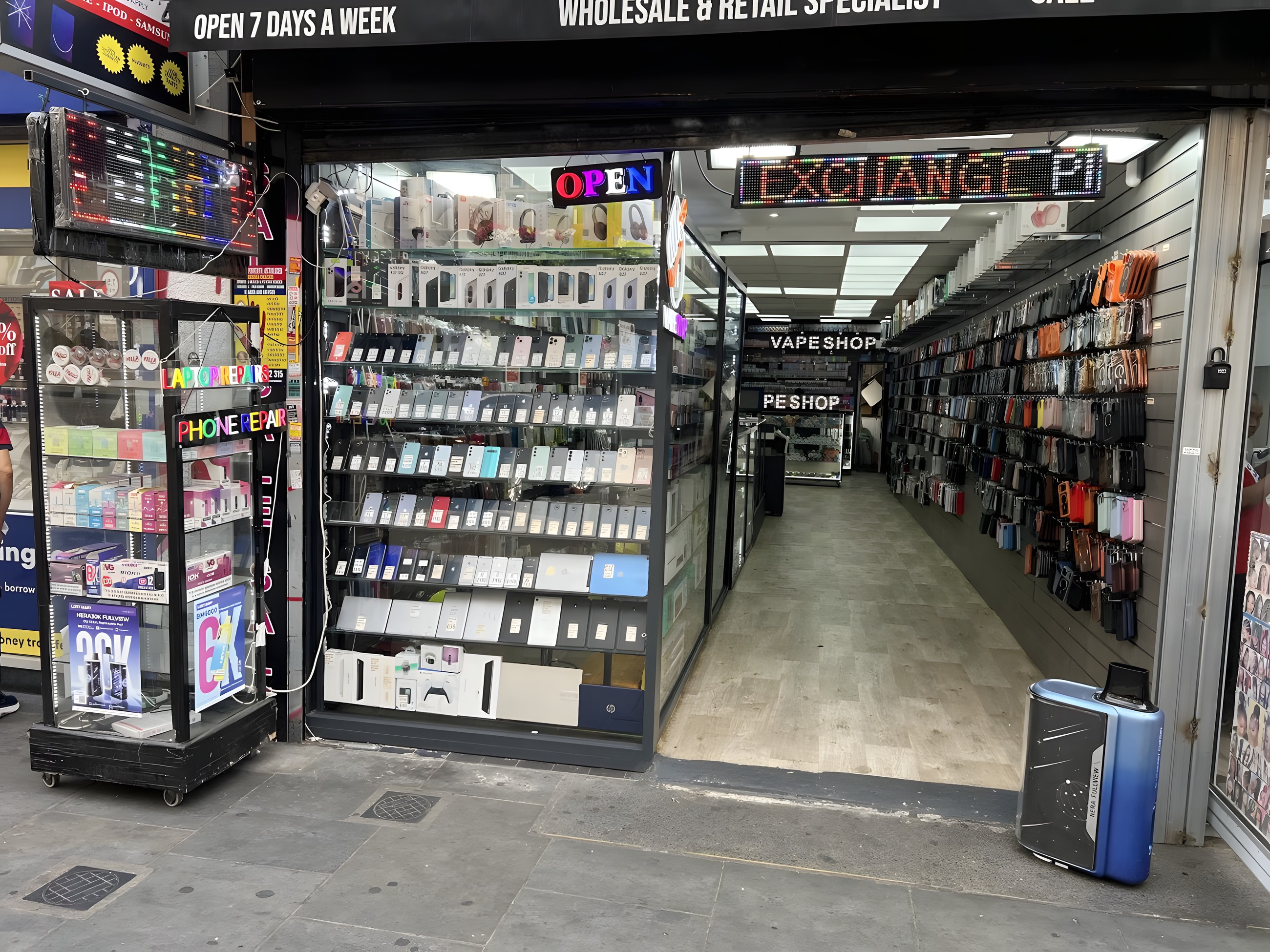 Inside Phone Tech, with the repair counter and accessory walls